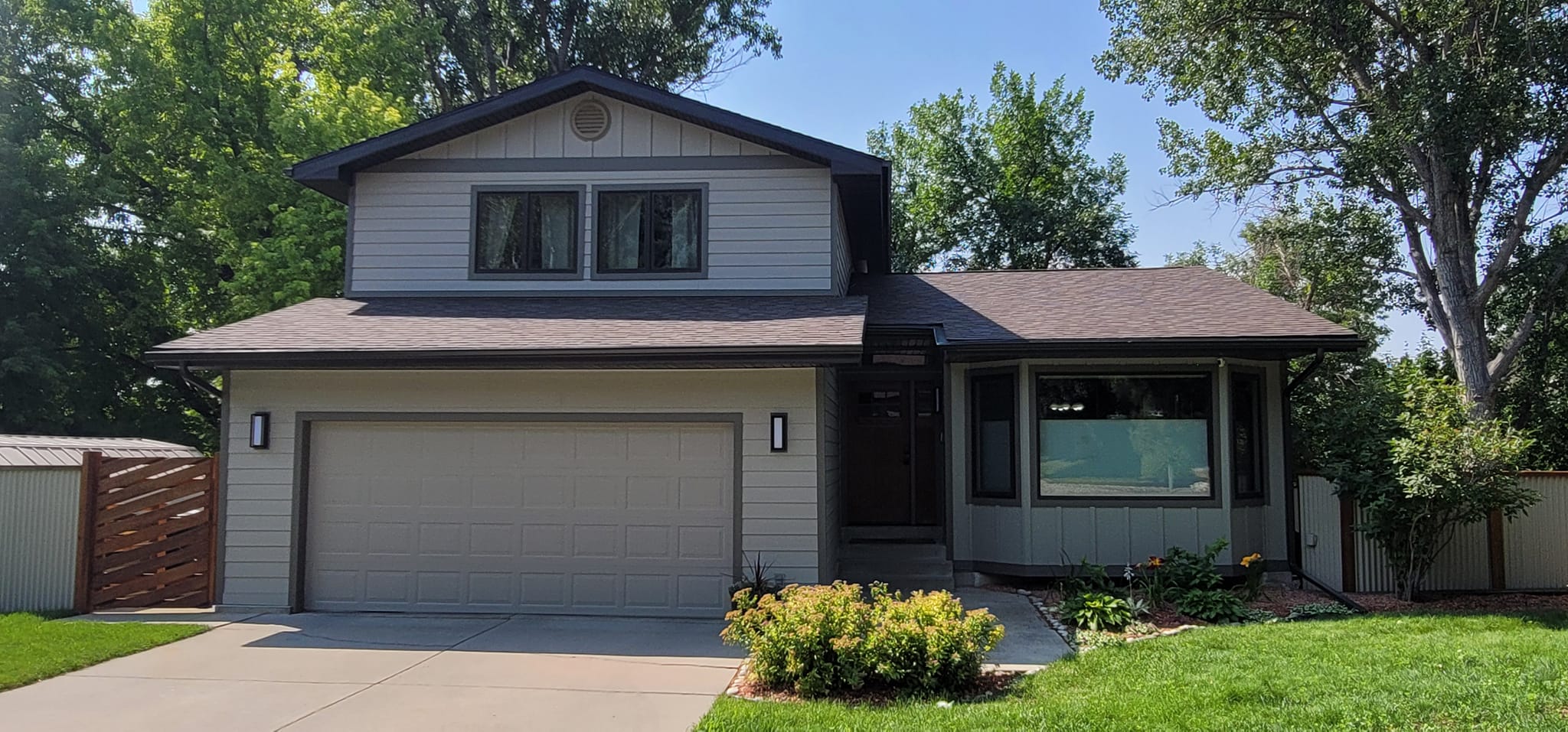 two-story home with two car garage.